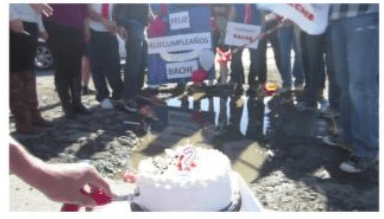 Residentes de la Colonia Satélite celebran el cumpleaños número 2 de un bache